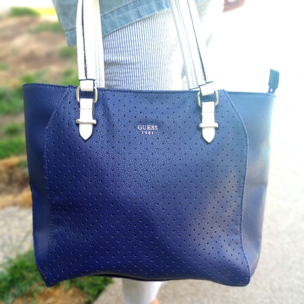 Blue and white Guess 1981 purse. Very roomy. Zipper closure.